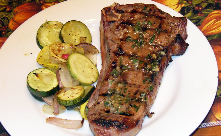 Garlic-Rubbed New York Steaks with Savory Tarragon Butter